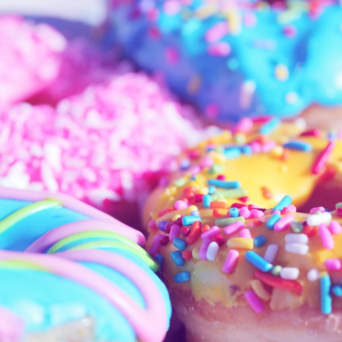 A close up of colourful donuts