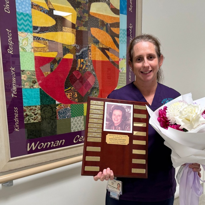 Midwife Renay James holds her Dorothy Edwards Scholarship award