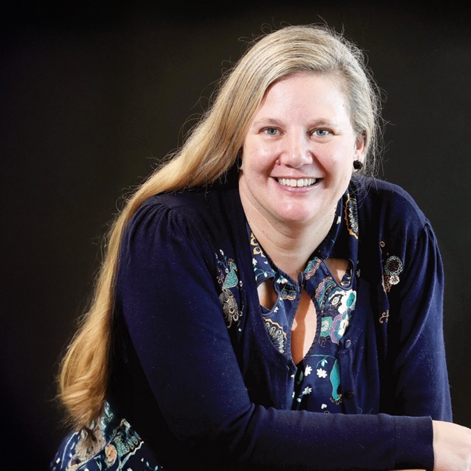 Woman smiling with black background
