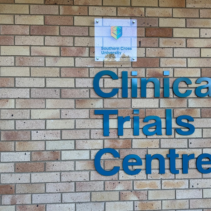 A brick facade with signage saying Clinical Trials Centre