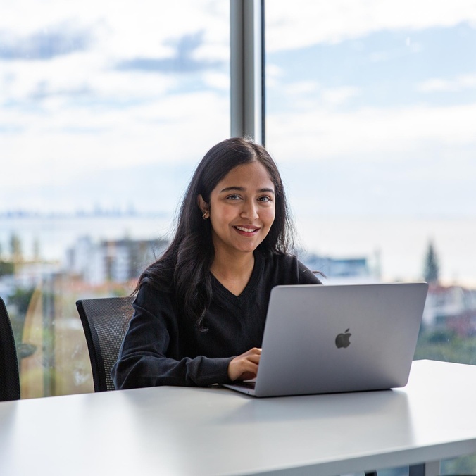 Student at a desk using a laptop