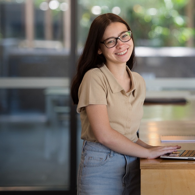 A student working at a standing desk