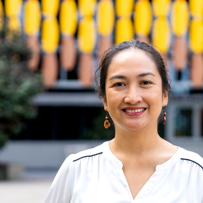 A woman smiling at the camera