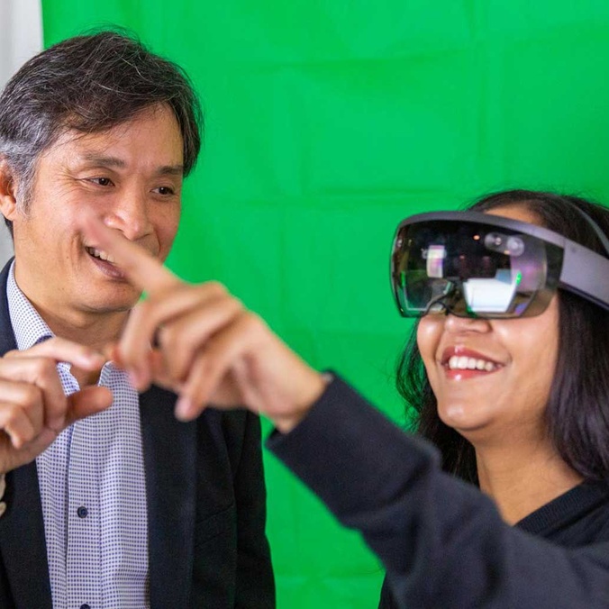 Two people using VR goggles