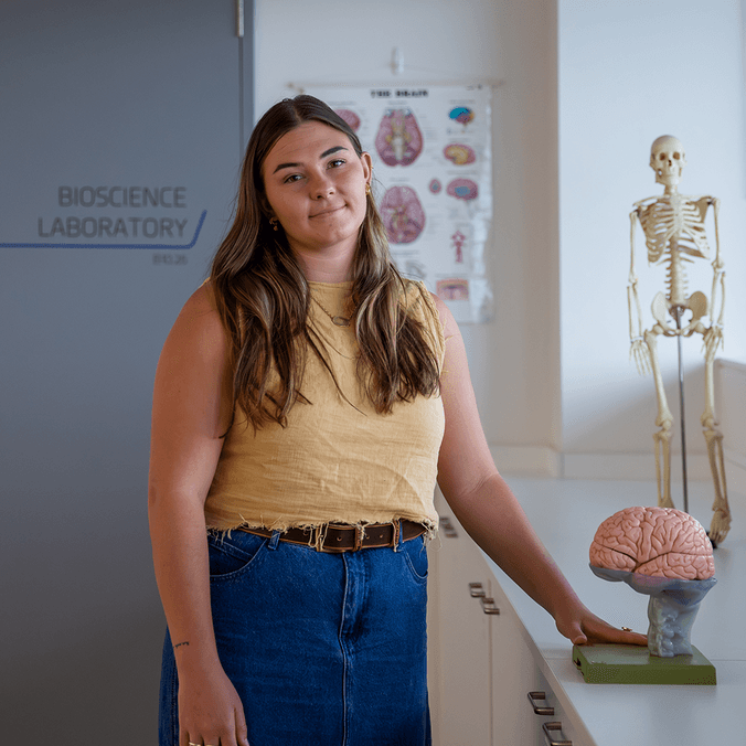 Olivia Noffke with brain models in health lab