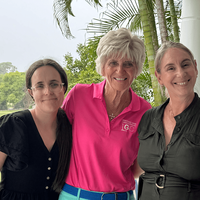 Three women smiling at camera