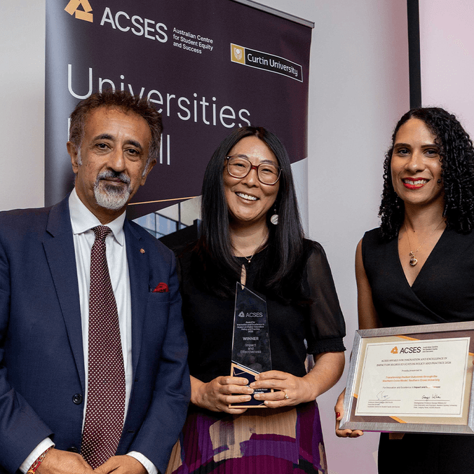 Professor Shamit Saggar (ACSES Executive Director) and Dr Cassy King (ACSES Awards Judging Panel Member and presenter of the award) with Dr Liz Good, who received the award on behalf of the Southern Cross University team.