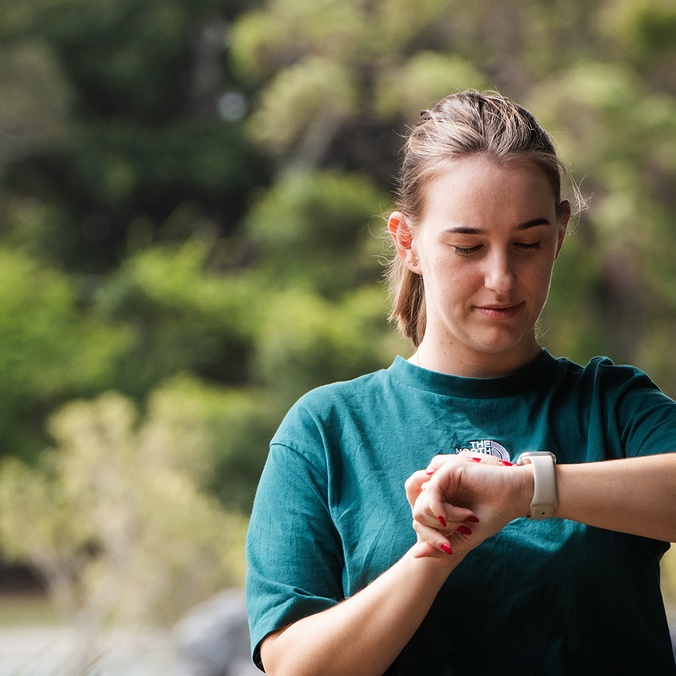 Woman looking at smart watch