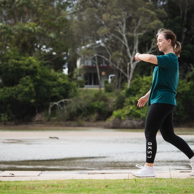 Woman walking win green shirt