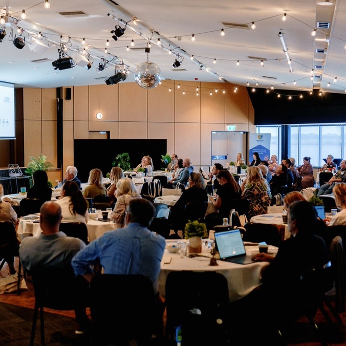 Speaker presenting at a conference