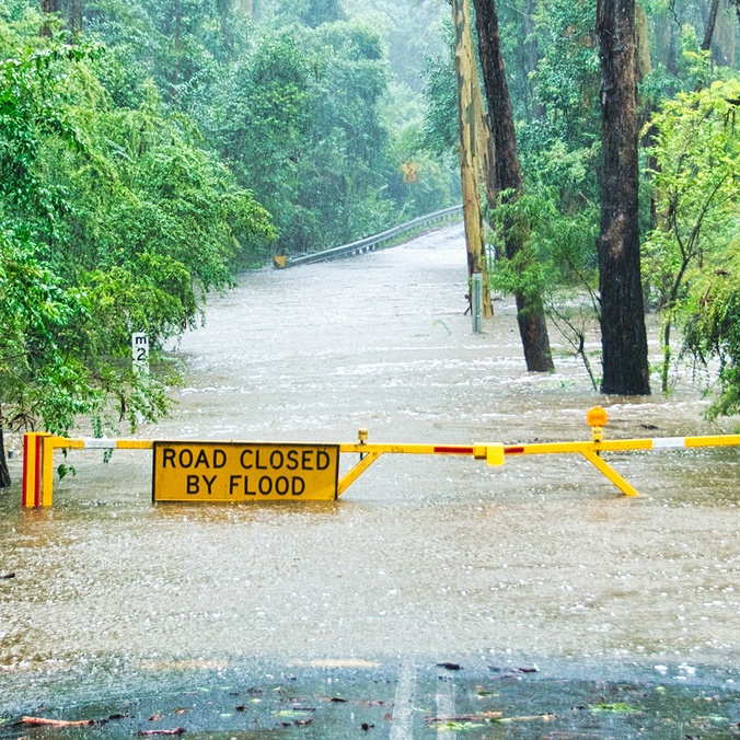 Flooded road with sign warning sign