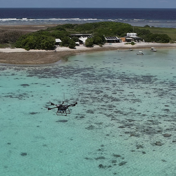 Drone flying above lagoon at One Tree Island