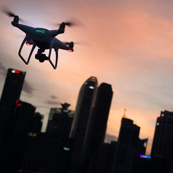 Drone over city at dusk_credit Goh Rhy Yan on Unsplash