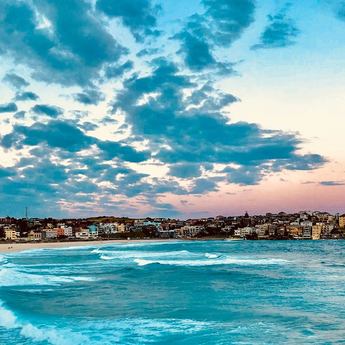 A view of a city beach at sunrise or sunset