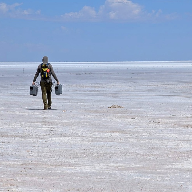 A man walking on a salt lake