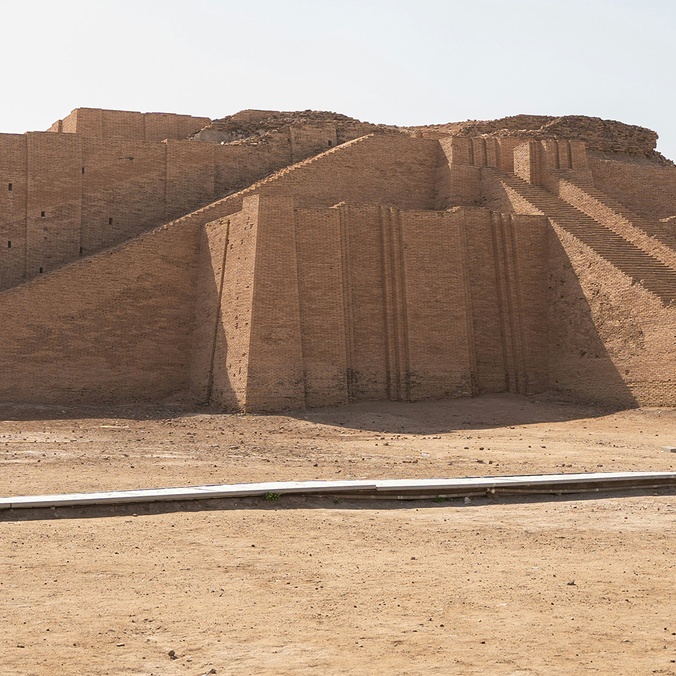 Large stone structure sitting in the middle of a desert
