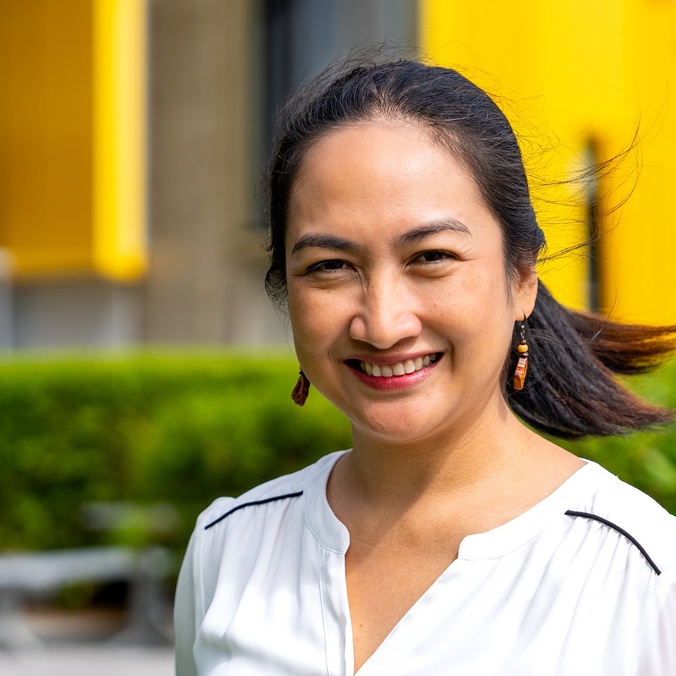 A woman smiling at the camera