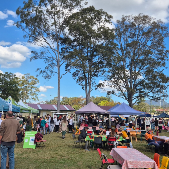A crowd milling around tents at Tweed Wold Environment Day