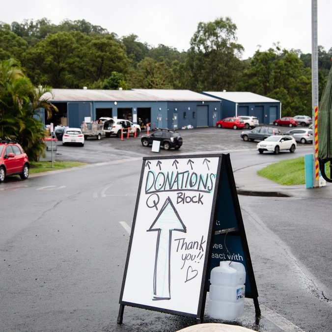 A poster board asking for donations