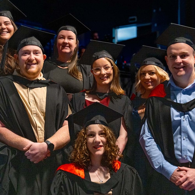 7 Students in the theatre prepared for graduation.