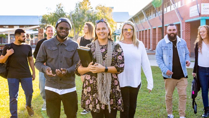 Group of students walking on the Coffs Harbour Campus