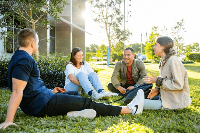 Students sitting on grass