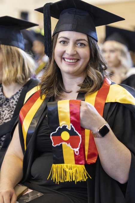 Student graduating wearing Aboriginal stole