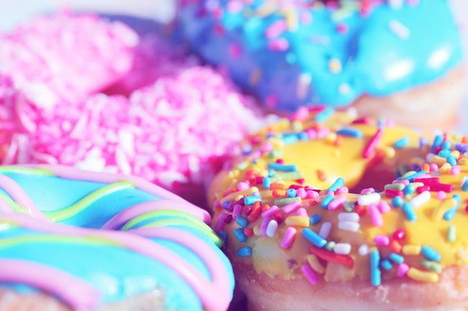 A close up of colourful donuts