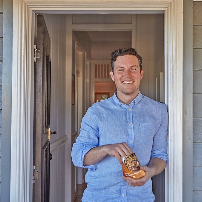 Will Brook opening a pack of Brookfarm muesli