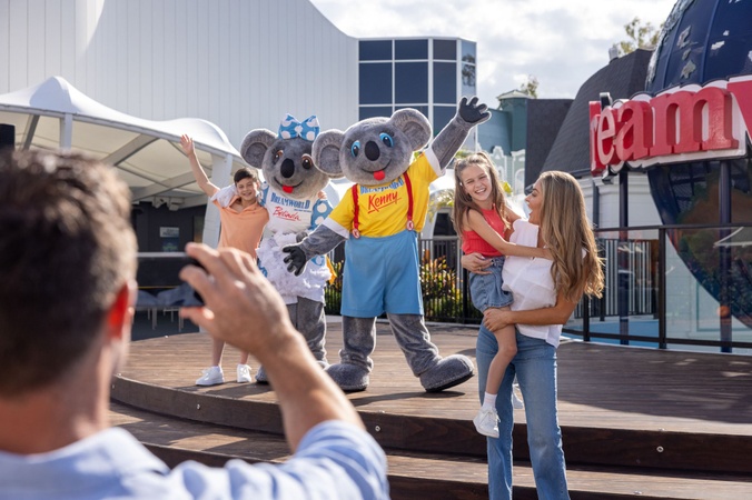 Family at Dreamworld with koalas