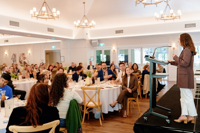 lunch and learn guests with speaker at lectern