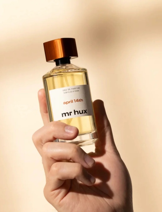hand holding fragrance bottle