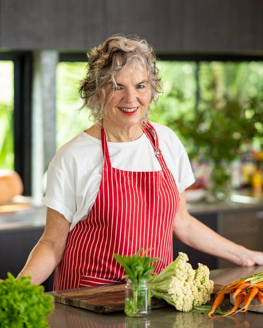 Pam Brook in an apron getting ready to cook