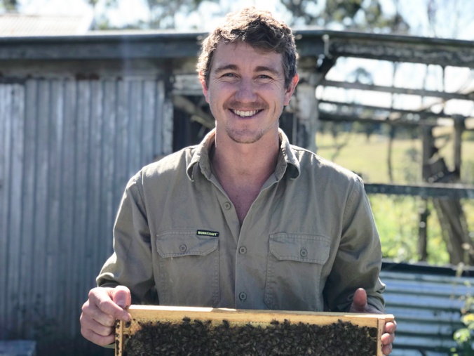 Man with bee honeycomb