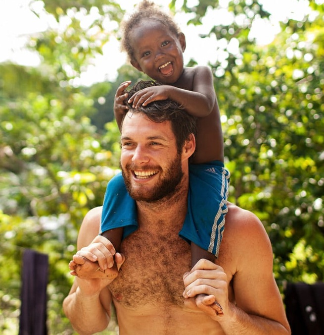 Lucas Handley with a child on his shoulders