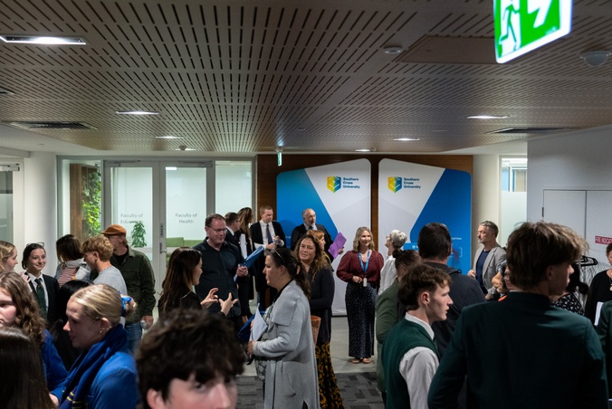 People mingling at Mock Trial 2025