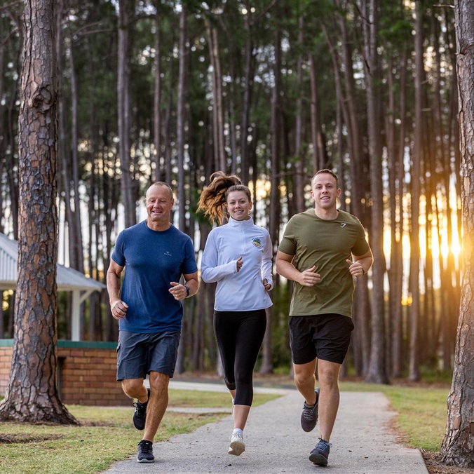 Isaac Hawkins and his family running through the park