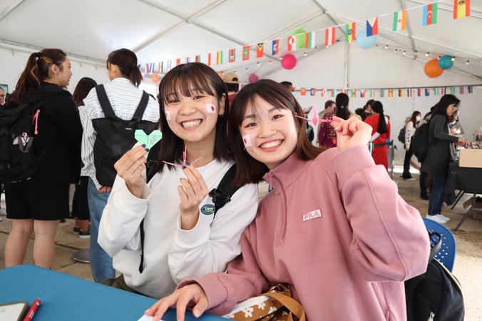 two students smiling for camera
