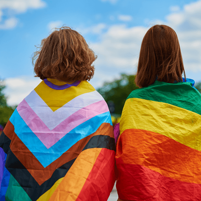 two people with backs to camera