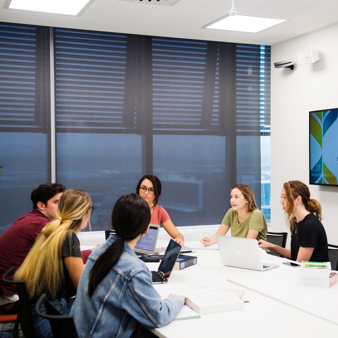 students discussing scenarios in a workshop environment