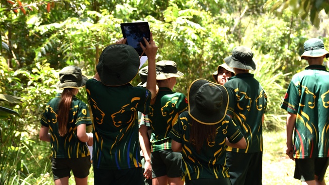Group of primary school children out in nature