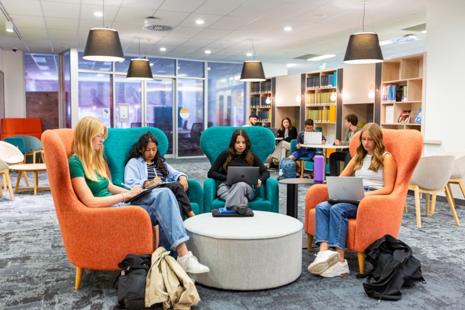Students studying on lounges
