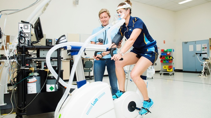 female student on cycle