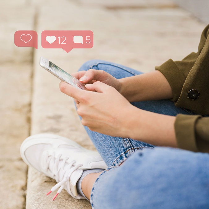 Close-up of woman sitting stairs using social-media app mobile