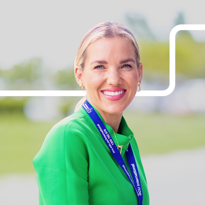 Martina S smiling at the camera with edited colour background