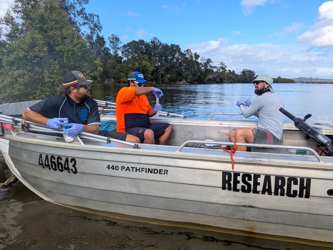 3 people in a SCU research boat
