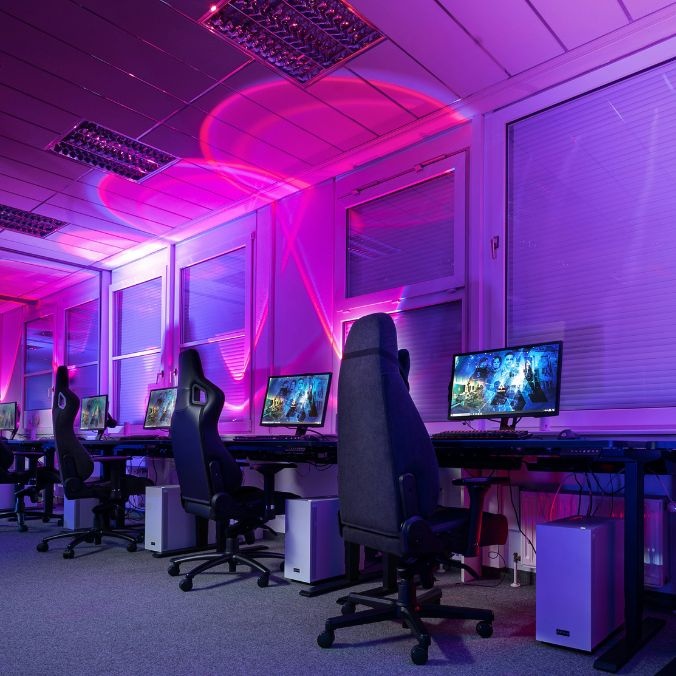A row of esports gaming consoles
