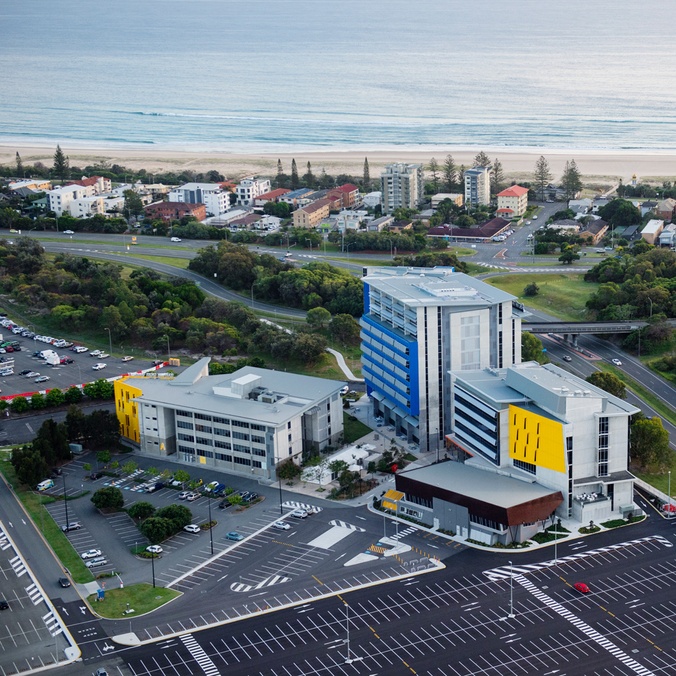 Aerial view of the Gold Coast campus with ocean view in the distance