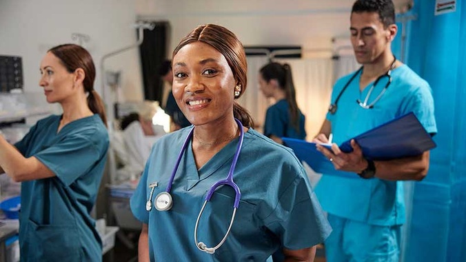 A nursing student looking at he camera