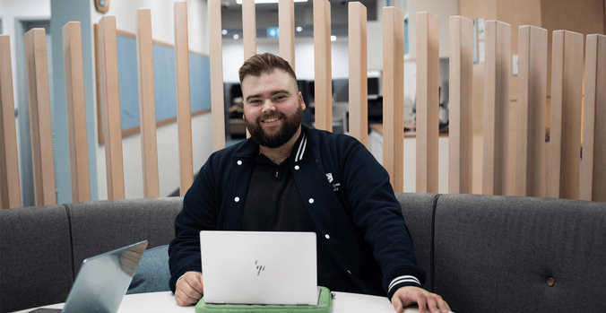 Student with laptop in library